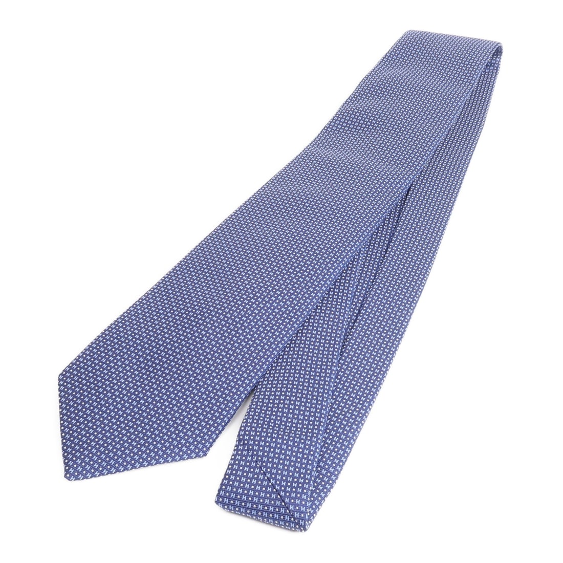 Silk Blue Necktie from Hermes France: Silk Blue Necktie from Hermes France This Hermes men's tie is crafted from high-quality silk and features a classic blue color. Made in France, it offers a refined touch suitable for formal and busine