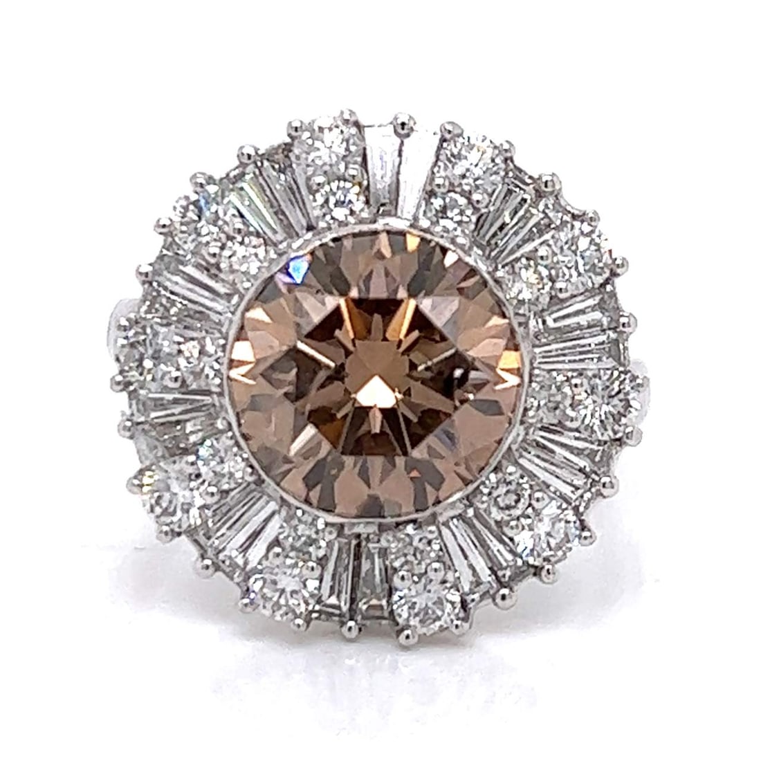 18K White Gold Fancy Brown Diamond Ring 3.36 Ct with 40 Additional Diamonds: 18K White Gold Fancy Brown Diamond Ring 3.36 Ct with 40 Additional Diamonds This stunning 18K White Gold ring features a breathtaking 3.36 Ct. Fancy Brown diamond at its center, showcasing SI2 clarity
