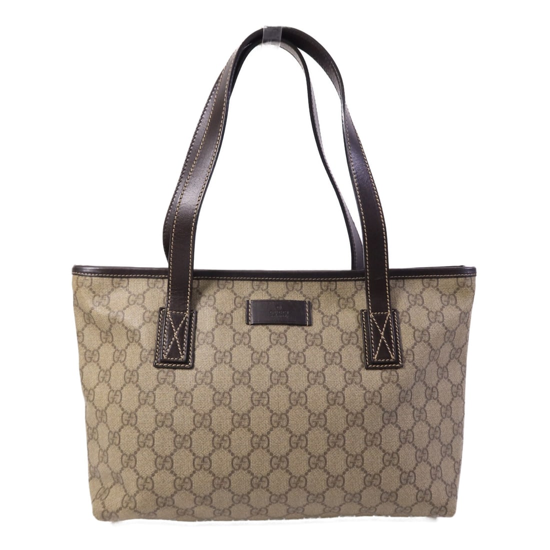 Gucci Brown Coated Canvas Tote Bag GG SHW: Gucci Brown Coated Canvas Tote Bag GG SHW This Gucci GG tote bag features a brown PVC coated canvas exterior, offering both durability and a classic look. Designed for women, the bag provides ample sp