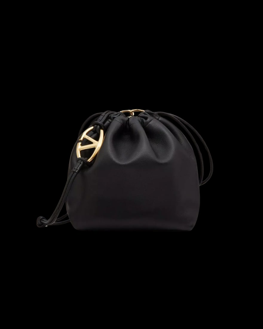 Valentino Garavani VLogo Pouf Black Leather Bucket Shoulder Bag: Valentino Garavani VLogo Pouf Black Leather Bucket Shoulder Bag The Valentino Garavani VLogo Pouf Bucket Bag is crafted from black leather and designed for women. This elegant shoulder bag is made in 