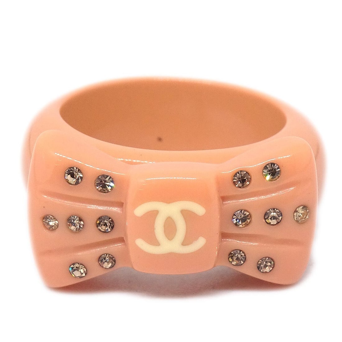 Chanel Vintage Pink Acrylic Rhinestone Ring Size 13: Chanel Vintage Pink Acrylic Rhinestone Ring Size 13 This vintage Chanel ring features a vibrant pink acrylic design adorned with sparkling rhinestones, showcasing a unique and fashionable style. Ideal
