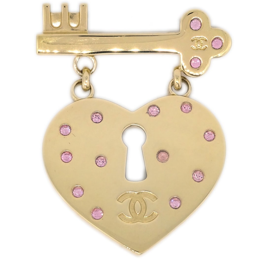 Chanel Vintage Gold Heart Rhinestone Brooch 02P: Chanel Vintage Gold Heart Rhinestone Brooch 02P This exquisite Chanel Heart Rhinestone Brooch is a stunning accessory that showcases a heart shape beautifully adorned with sparkling rhinestones. Craft