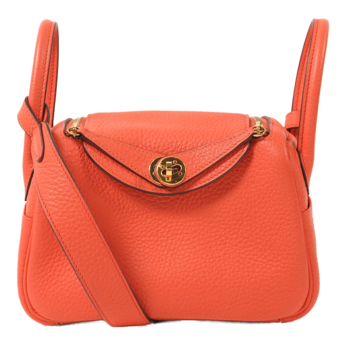 Hermes Mini Lindy Rose Texas Calfskin Pink Shoulder Bag with Gold Tone Hardware: Hermes Mini Lindy Rose Texas Calfskin Pink Shoulder Bag with Gold Tone Hardware This Hermes Mini Lindy shoulder bag is crafted from Taurillon Clemence calfskin leather in a pink Rose Texas shade. It f