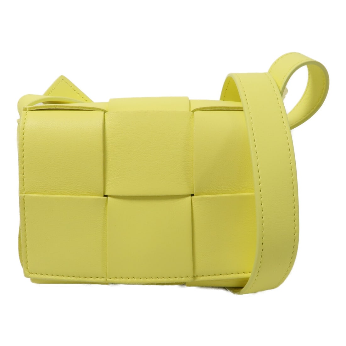 Bottega Veneta Mini Cassette Lambskin Shoulder Bag Yellow GHW: Bottega Veneta Mini Cassette Lambskin Shoulder Bag Yellow GHW This Bottega Veneta Mini Cassette Bel shoulder bag is crafted from luxurious lambskin leather in a vibrant yellow color. Designed for wome