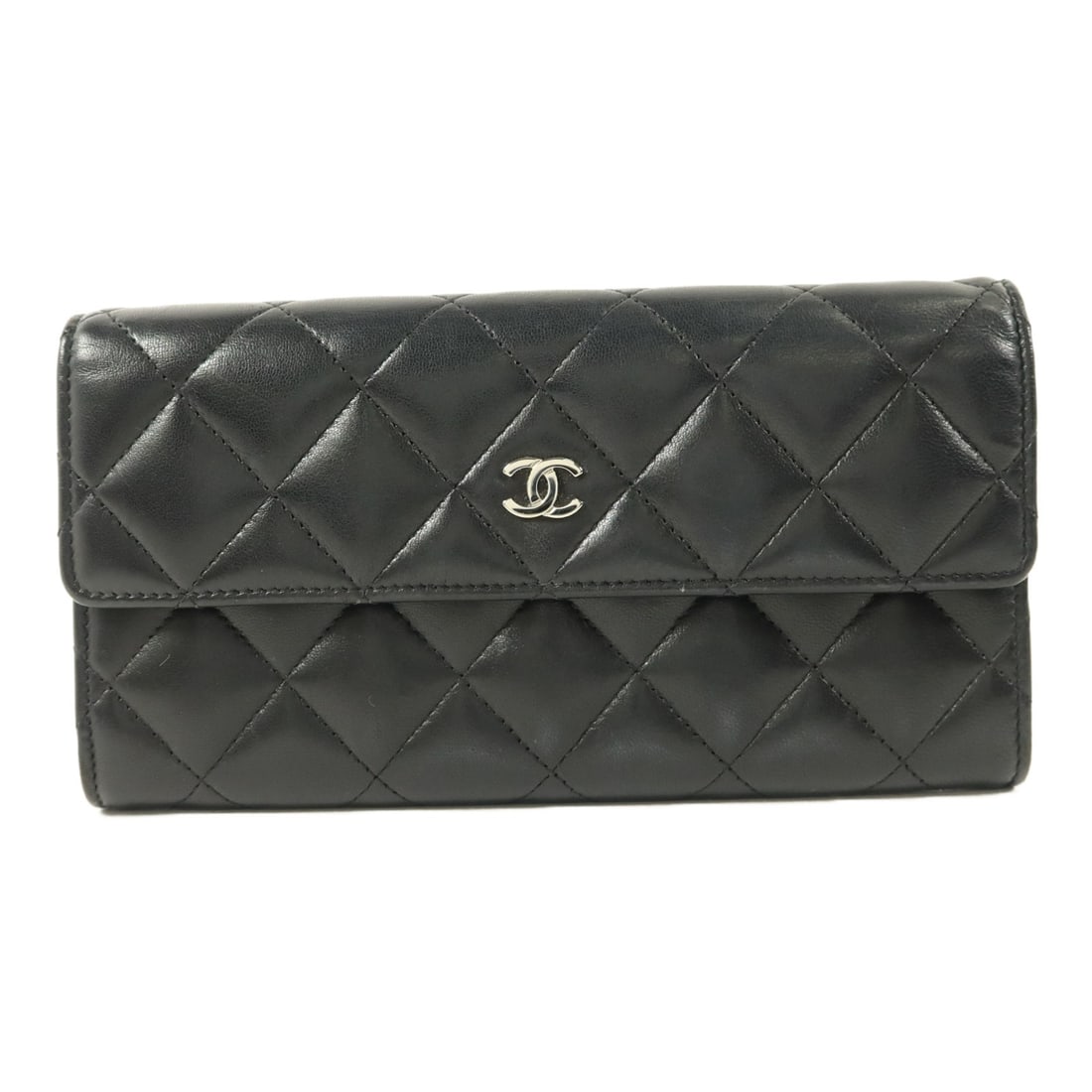 CHANEL Black Lambskin CC Bifold Wallet: CHANEL Black Lambskin CC Bifold Wallet This CHANEL bifold wallet is crafted from luxurious black lambskin leather and features silver-tone hardware. Designed for women, it offers a classic and elegant