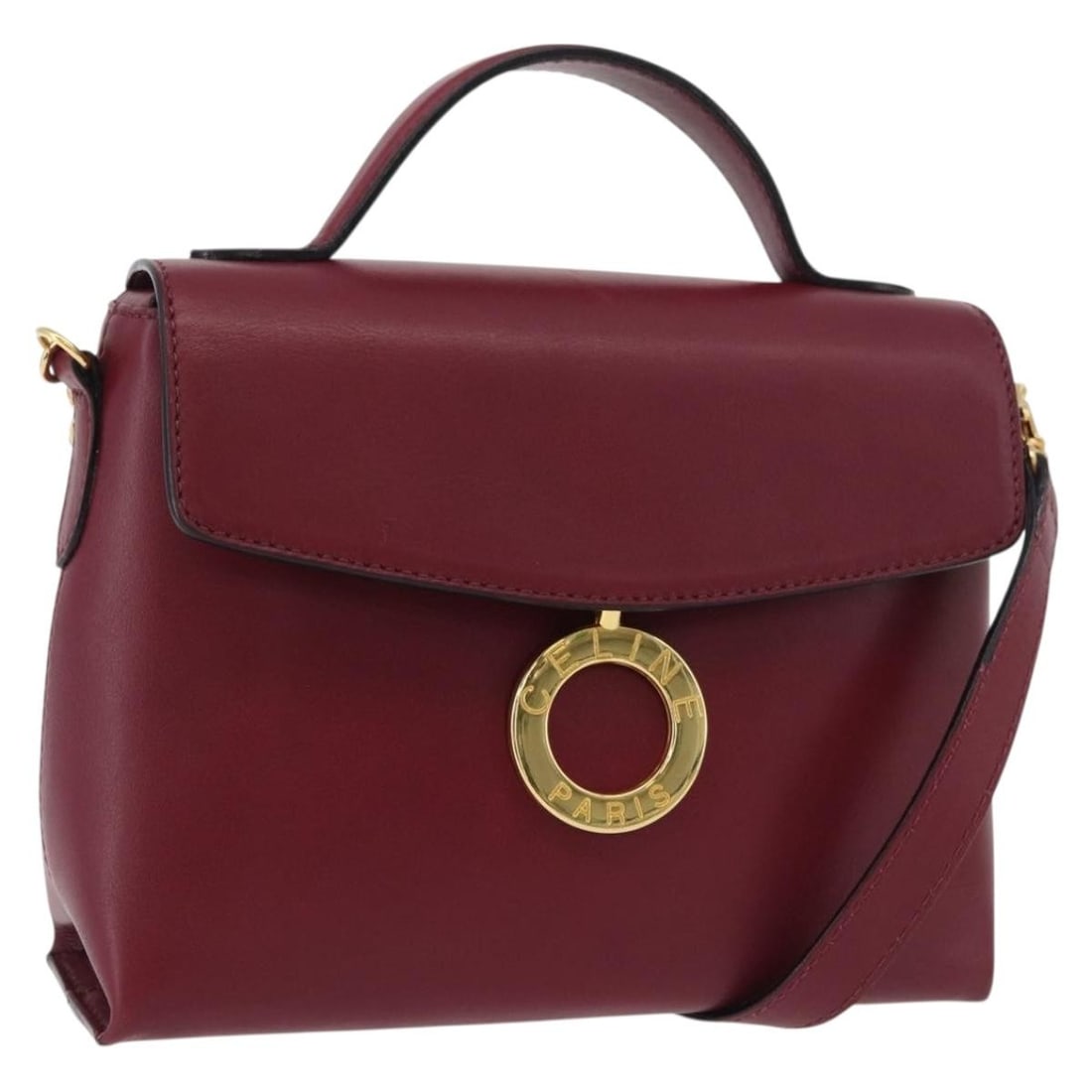CELINE leather 2way wine red gold handbag with dust bag and shoulder strap: CELINE leather 2way wine red gold handbag with dust bag and shoulder strap This CELINE Circle handbag features a wine red leather exterior with gold-tone accents and offers versatile carrying options 