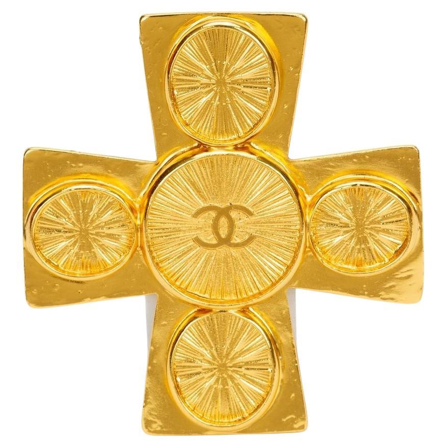 Gold Plated Vintage Maltese Cross Brooch with Chanel CC Logo: Gold Plated Vintage Maltese Cross Brooch with Chanel CC Logo This vintage Chanel brooch features a Maltese cross design crafted from gold-plated metal, highlighted by the iconic CC logo at its center.