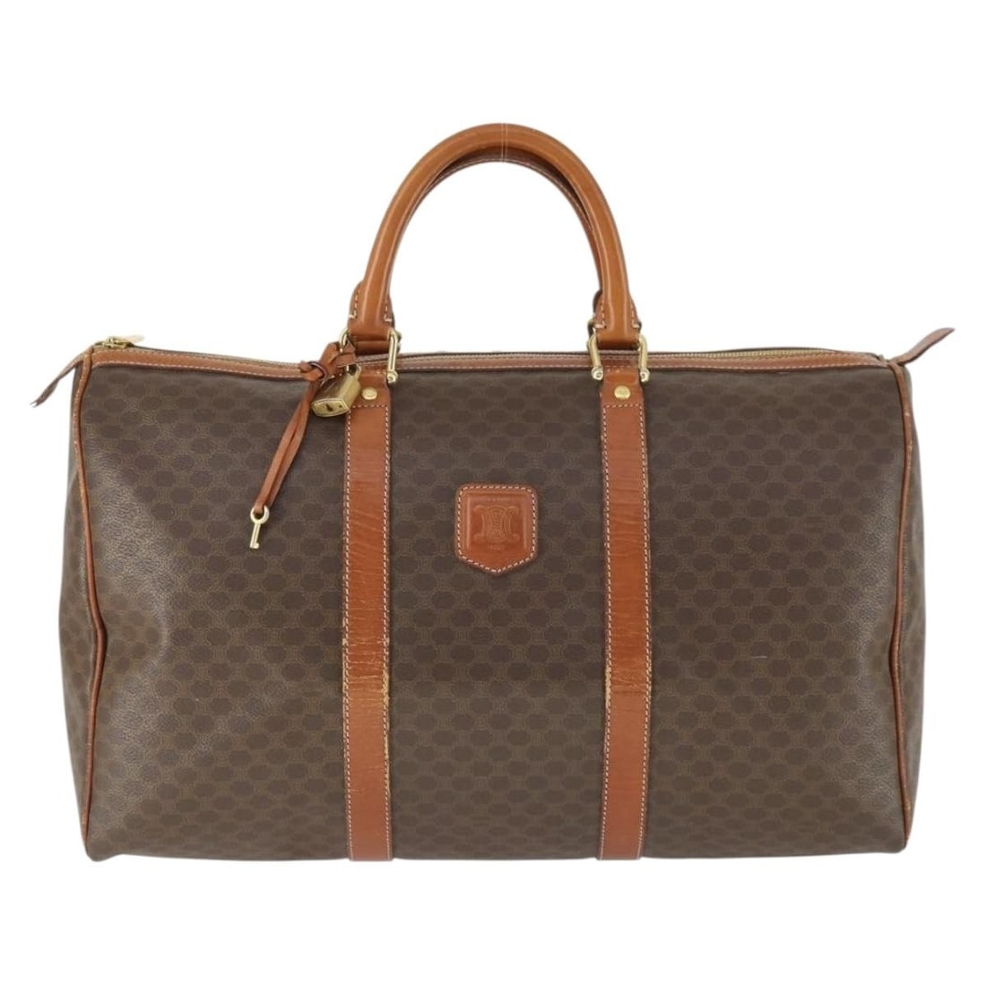 Vintage Celine Macadam Boston Canvas PVC Unisex Bag 45cm: Vintage Celine Macadam Boston Canvas PVC Unisex Bag 45cm This vintage Celine Macadam Boston bag features a unisex design crafted from brown PVC canvas. It has a spacious interior suitable for daily us