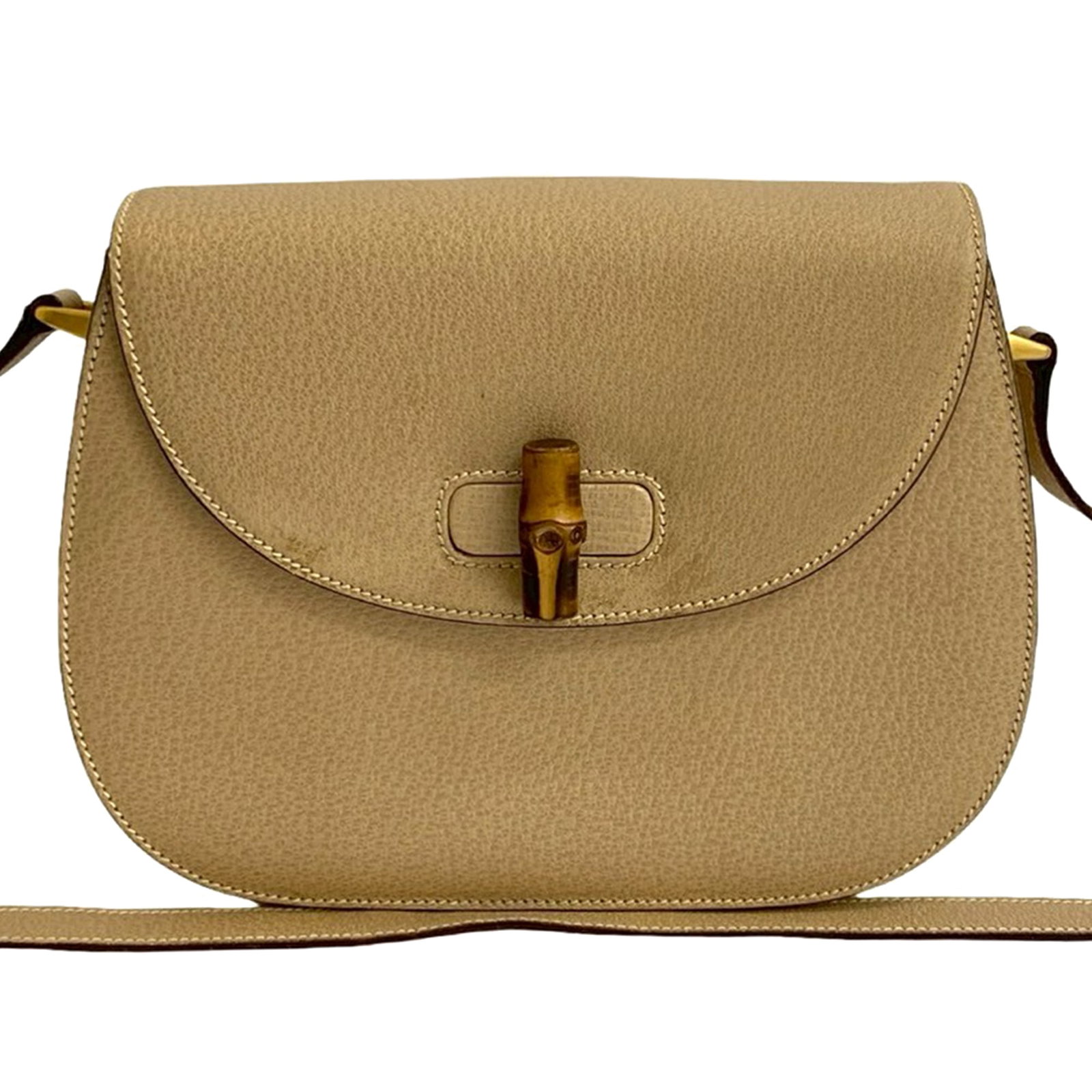Gucci Bamboo Beige Leather Crossbody Bag with Adjustable Strap: Gucci Bamboo Beige Leather Crossbody Bag with Adjustable Strap This Gucci Grained Calfskin Bamboo Crossbody bag features a beige leather body, an adjustable flat leather strap, a front flap with a tur