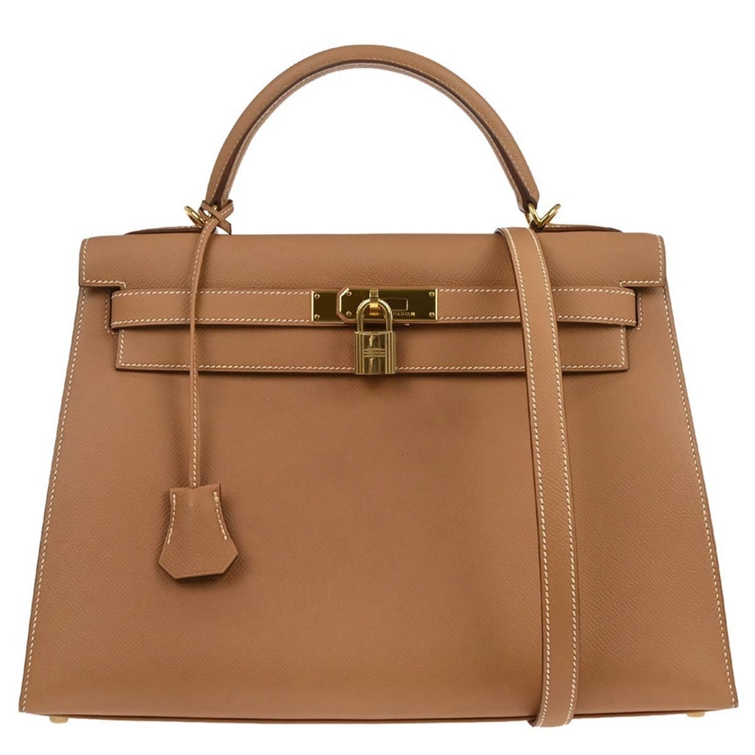 Beige Courchevel Leather Kelly 32 Sellier Top Handle Bag by Hermes: Beige Courchevel Leather Kelly 32 Sellier Top Handle Bag by Hermes This Hermes Kelly 32 Sellier 2way handbag features natural Courchevel leather in a beige color with gold-tone hardware. It offers ver