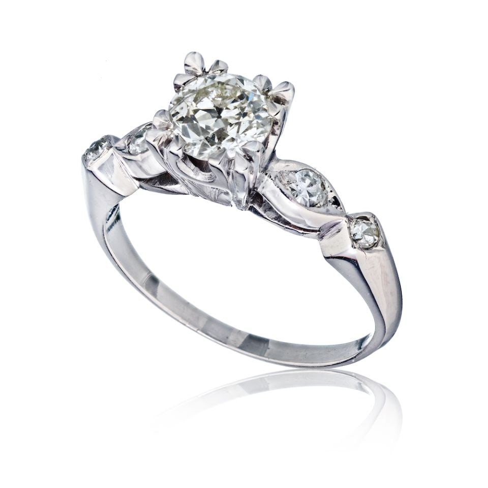Vintage Platinum Engagement Ring with .80ct Old European Cut Diamond K-L SI2: Vintage Platinum Engagement Ring with .80ct Old European Cut Diamond K-L SI2 Discover this exquisite vintage engagement ring featuring an approximate .80 carat Old European Cut diamond, graded K-L in 