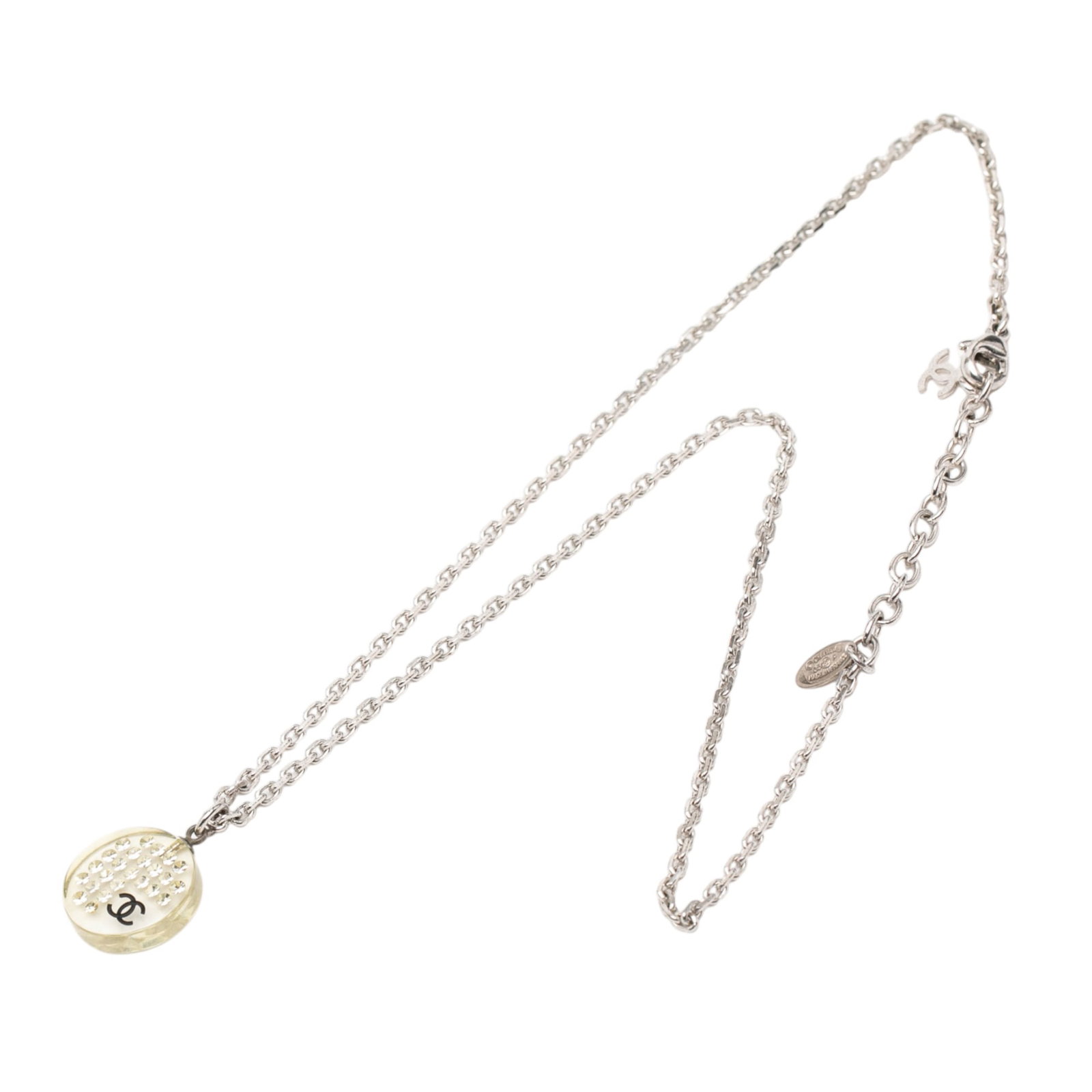 Chanel Resin Pendant Necklace with Silver Plating and Rhinestones: Chanel Resin Pendant Necklace with Silver Plating and Rhinestones This Chanel necklace features a silver-plated metal body with a resin pendant embellished with rhinestones. It is secured with a lobst