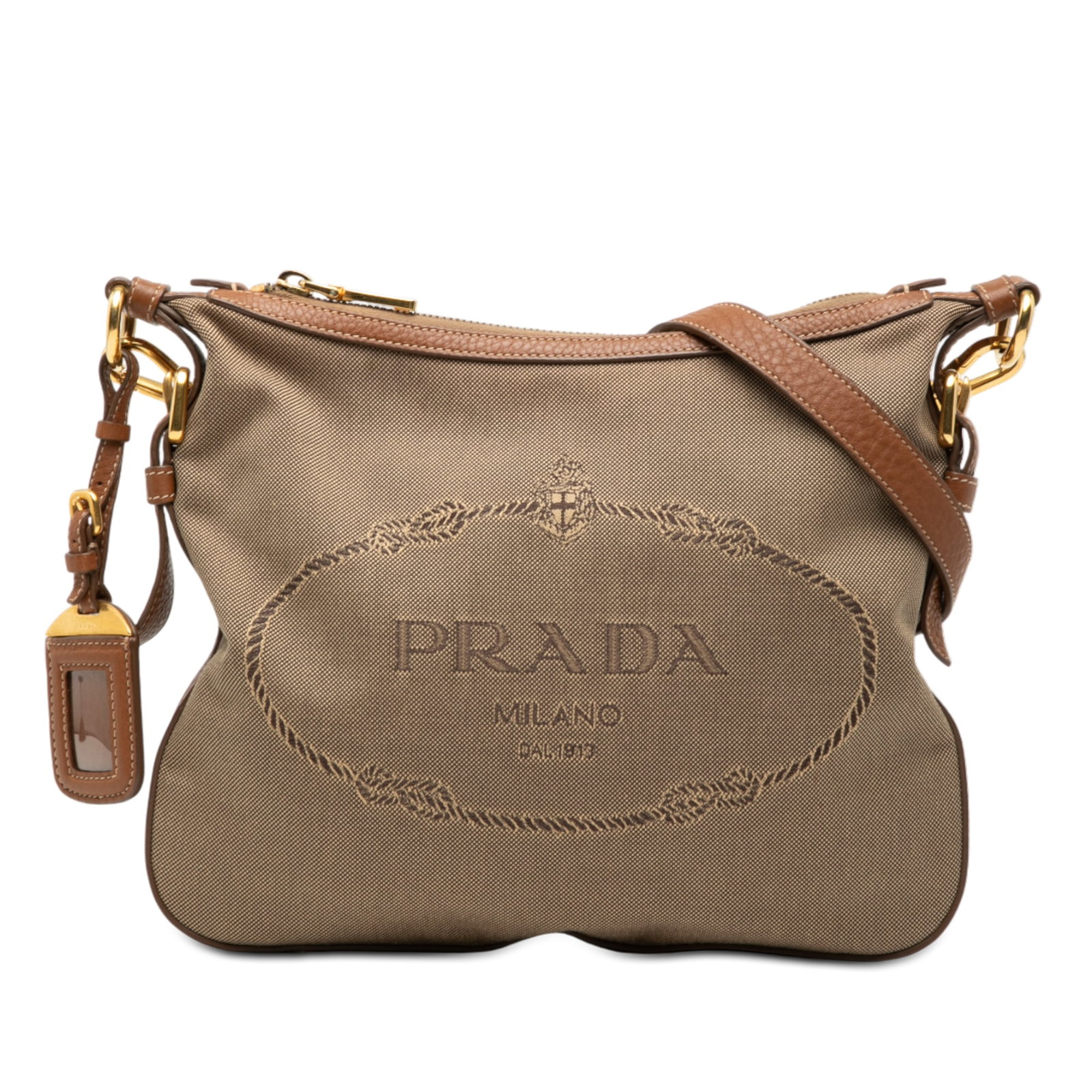 Prada Canapa Canvas Crossbody Bag with Logo and Leather Trim: Prada Canapa Canvas Crossbody Bag with Logo and Leather Trim This Prada Canvas Canapa Logo Crossbody bag features a beige canvas body with leather trim, a detachable and adjustable flat leather strap,