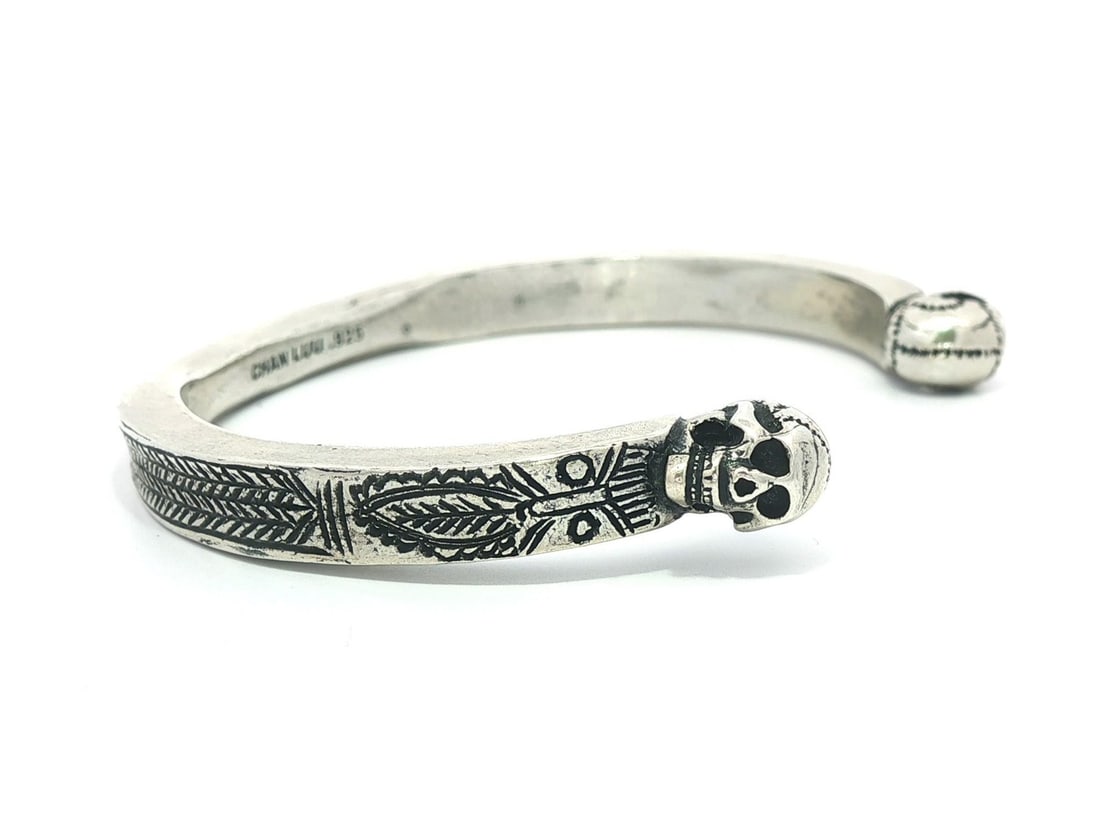 Sterling Silver Skull Etched Open Cuff Bracelet by Chan Luu: Sterling Silver Skull Etched Open Cuff Bracelet by Chan Luu This elegant open cuff bracelet features detailed skull etching work, crafted from high-quality sterling silver (.925). Designed as a cuff s