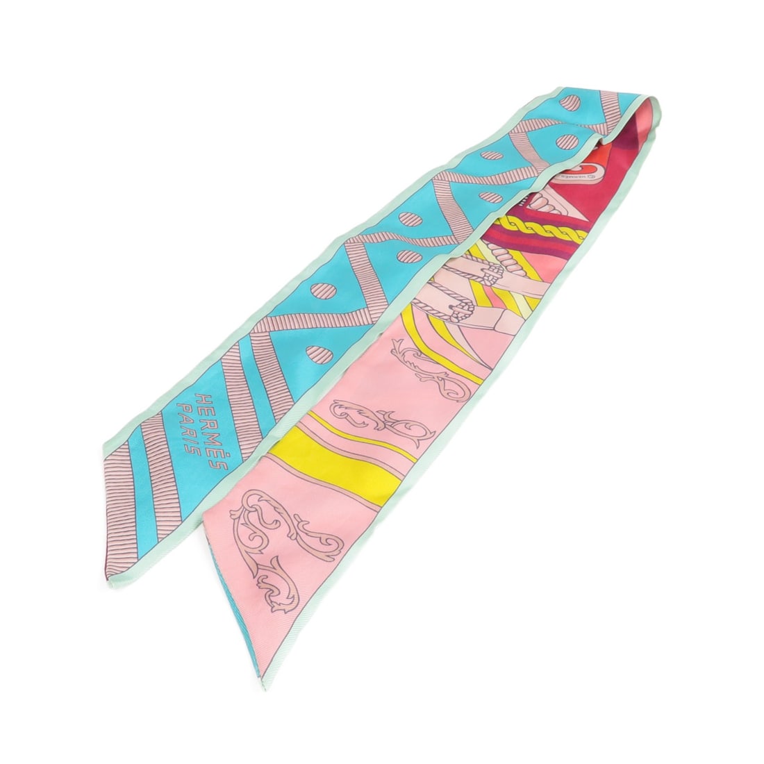 Hermes Silk Twilly Scarf in Green Pink Red Multicolor for Women: Hermes Silk Twilly Scarf in Green Pink Red Multicolor for Women This Hermes Twilly scarf is crafted from silk and features a vibrant green, pink, red, and multicolor design. Designed for women, this r