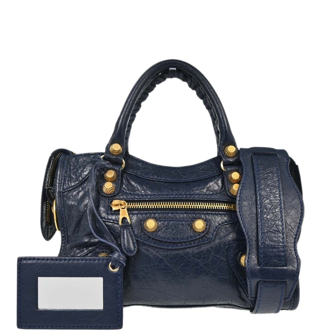 Mini City Navy Lambskin Handbag by Balenciaga with Logo Accents: Mini City Navy Lambskin Handbag by Balenciaga with Logo Accents This Balenciaga City Mini handbag is crafted from navy lambskin leather and features a top handle design with inner pockets for added fu