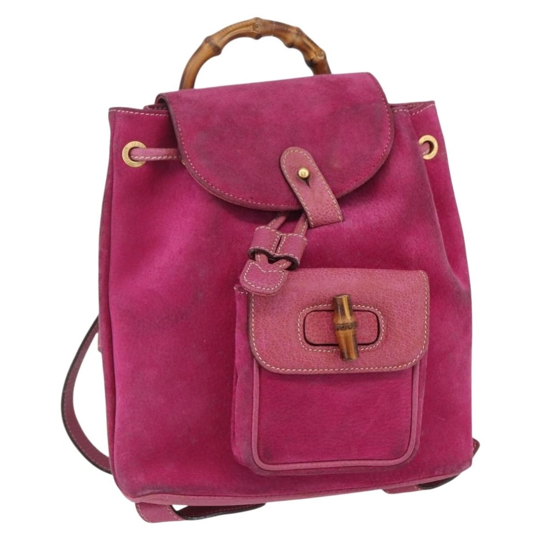 Gucci Suede Pink Vintage Bamboo Backpack for Women: Gucci Suede Pink Vintage Bamboo Backpack for Women This vintage Gucci Bamboo Backpack for women features a pink suede exterior and bamboo handle. Despite signs of wear including surface rubbing, stain