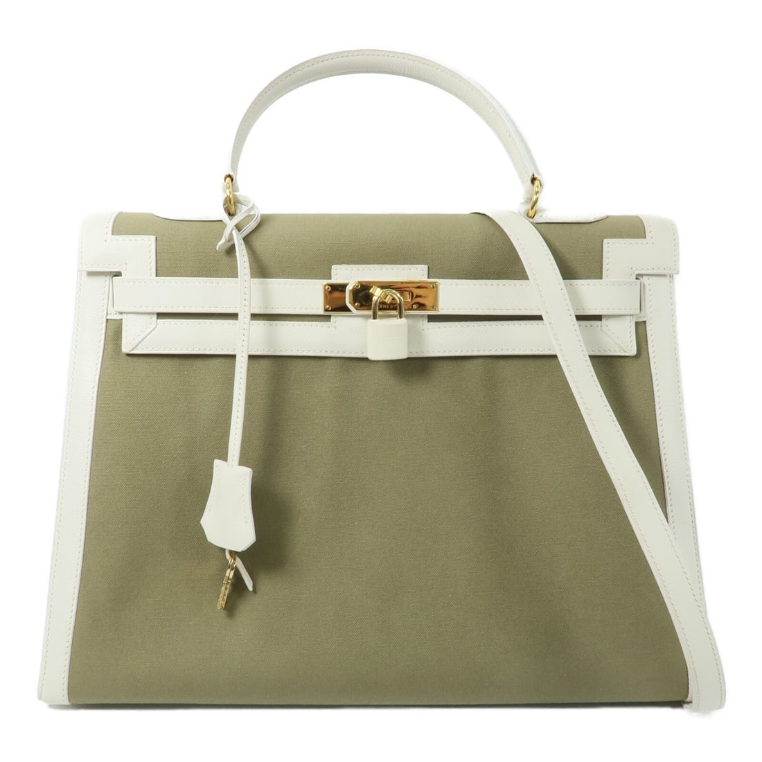 Hermes Kelly 35 Green Canvas 2 Way Shoulder Bag GHW: Hermes Kelly 35 Green Canvas 2 Way Shoulder Bag GHW This Hermes Kelly 35 is a versatile 2-way shoulder bag crafted from green canvas. Designed for women, the bag features a structured silhouette and i