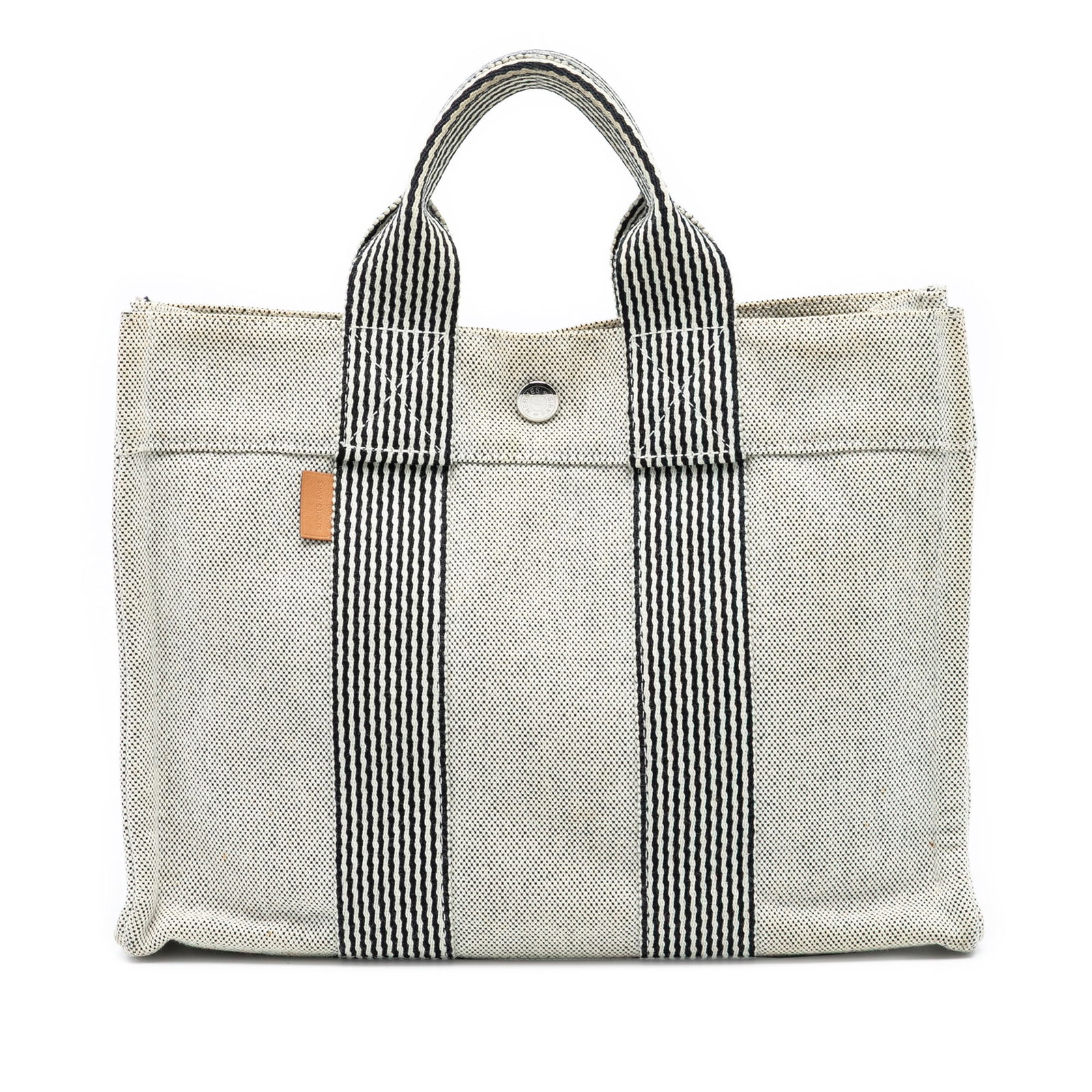 Hermes Fourre Tout PM Gray Canvas Tote Bag with Snap Closure: Hermes Fourre Tout PM Gray Canvas Tote Bag with Snap Closure The Hermes Fourre Tout PM tote bag is crafted from durable canvas, featuring flat handles, an open top with a snap button closure, and an i