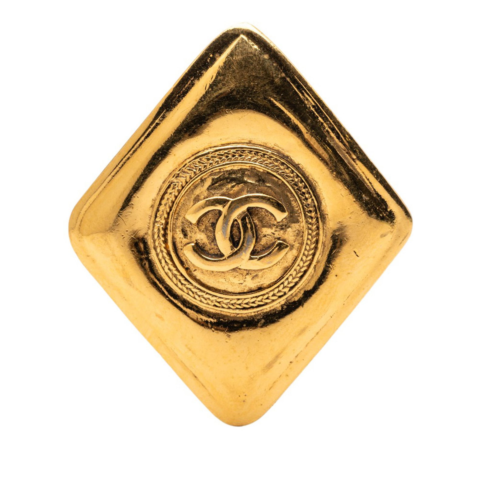 Chanel CC Rhombus Gold Tone Metal Brooch from France: Chanel CC Rhombus Gold Tone Metal Brooch from France This Chanel brooch features a gold tone metal body in a distinctive rhombus shape with the iconic CC logo. It is designed with a back pin closure a