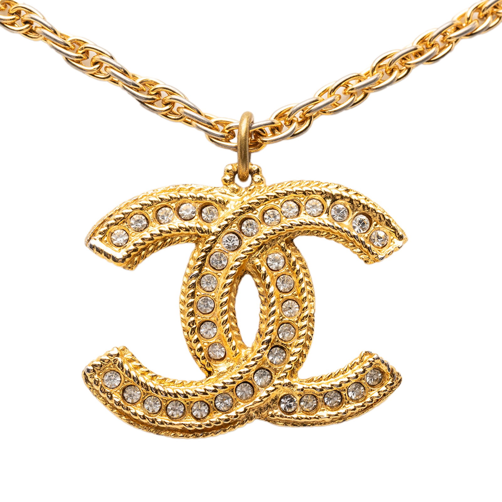 Chanel Crystal Embellished Gold Tone CC Pendant Necklace: Chanel Crystal Embellished Gold Tone CC Pendant Necklace This Chanel necklace features a gold-tone metal CC pendant adorned with crystal embellishments, suspended from a gold-tone chain with a spring 