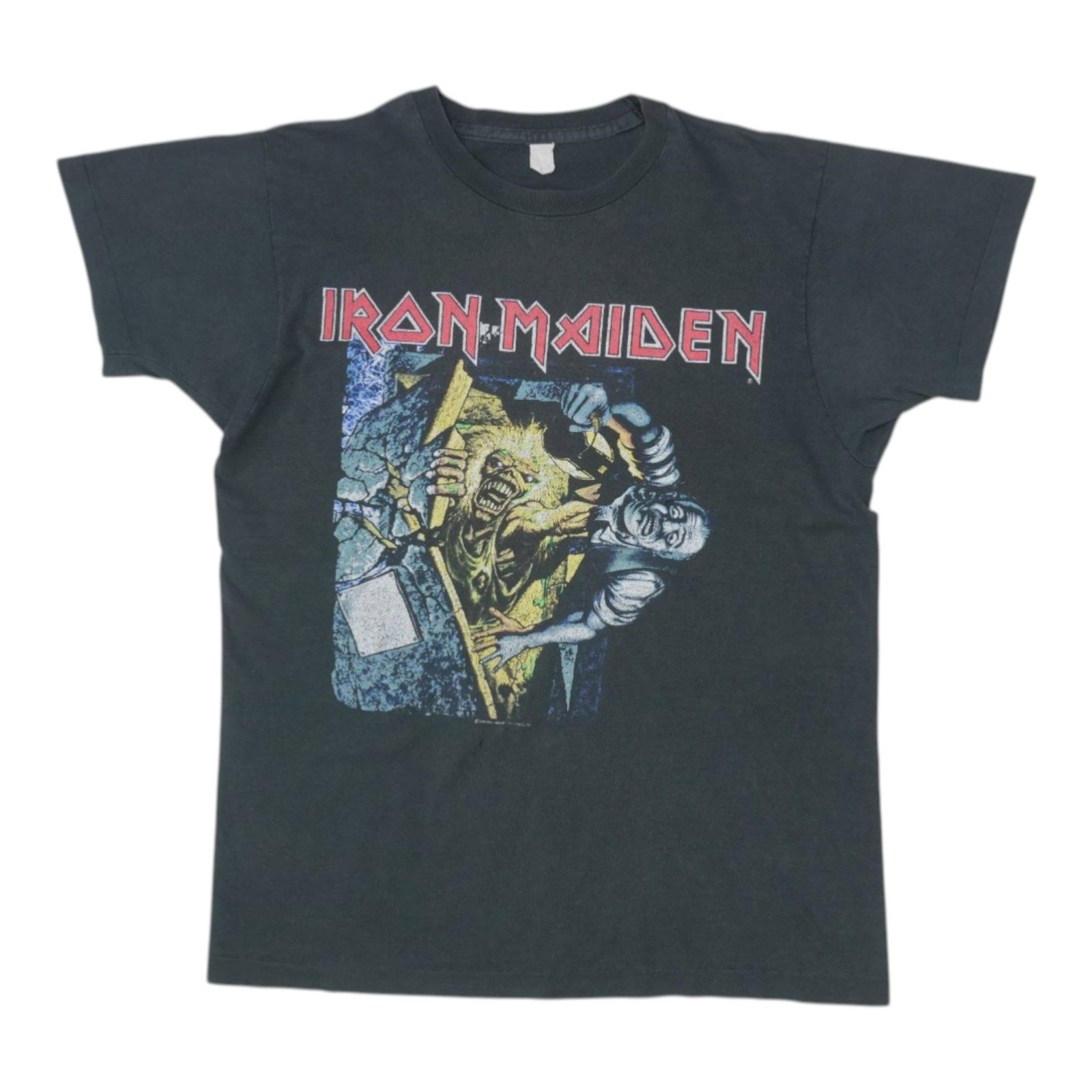 Vintage 1990 Black Cotton Iron Maiden No Prayer On The Road Tee: Vintage 1990 Black Cotton Iron Maiden No Prayer On The Road Tee This is an original vintage 1990 Iron Maiden No Prayer On The Road Shirt featuring front and back graphics. Made from 100% cotton, the b