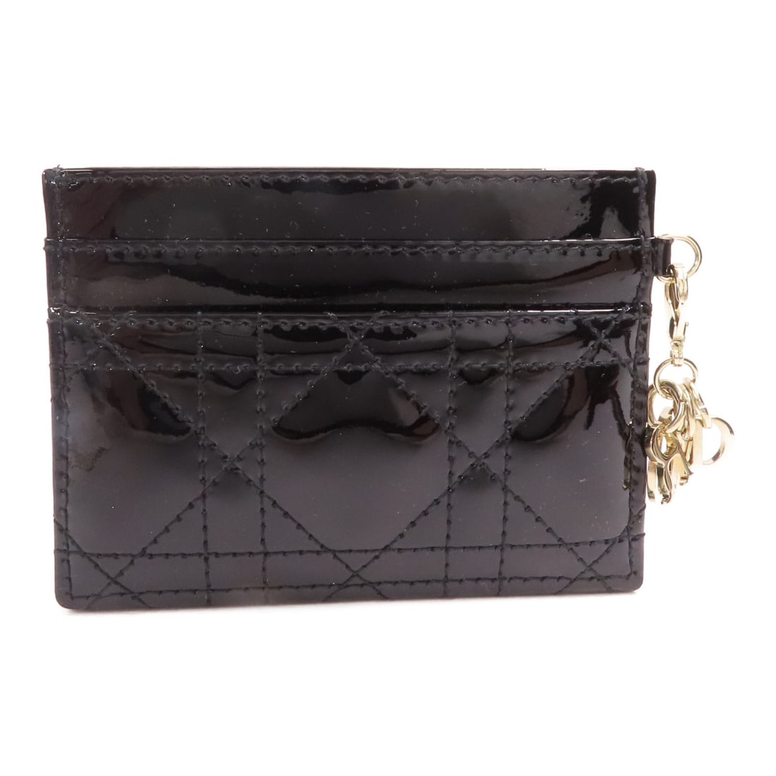 Dior Freesia Black Patent Leather Card Holder for Women: Dior Freesia Black Patent Leather Card Holder for Women This Christian Dior CD Freesia card case features a sleek black patent leather design, crafted for women. The compact accessory showcases a soph
