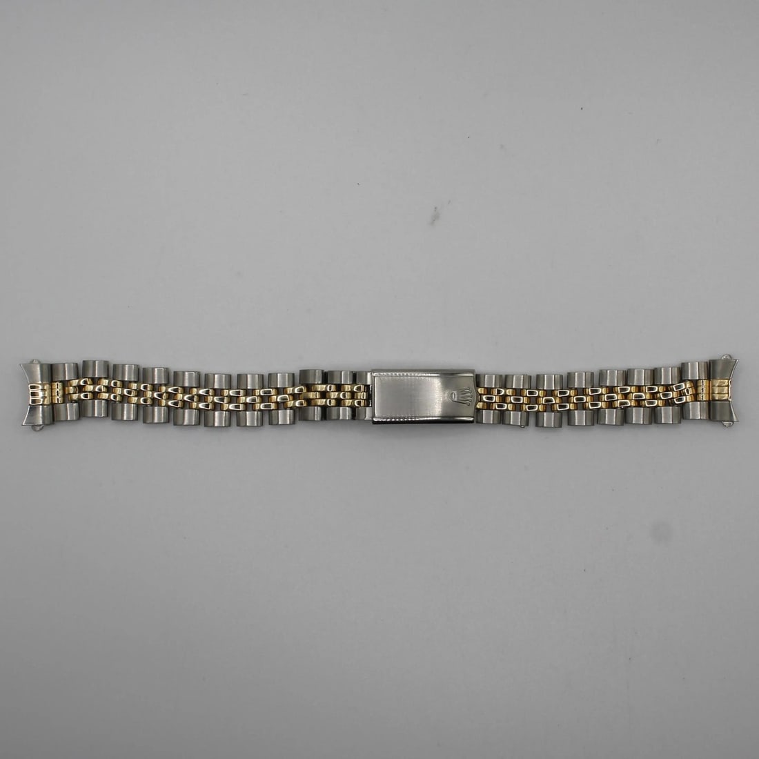 Rolex Jubilee Two Tone 14K Yellow Gold Stainless Steel 13MM Bracelet: Rolex Jubilee Two Tone 14K Yellow Gold Stainless Steel 13MM Bracelet Enhance your Rolex watch with this exquisite Jubilee bracelet, designed specifically for a 26MM watch. This two-tone band features 
