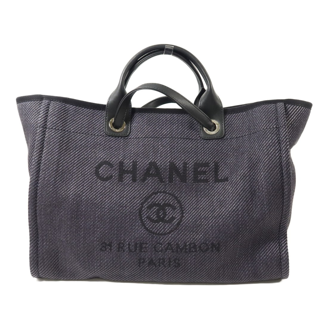 CHANEL Deauville Canvas Black Tote Shoulder Bag: CHANEL Deauville Canvas Black Tote Shoulder Bag This CHANEL Deauville tote bag features a versatile 2-way design, allowing it to be carried as a tote or worn as a shoulder bag. Crafted from durable bl