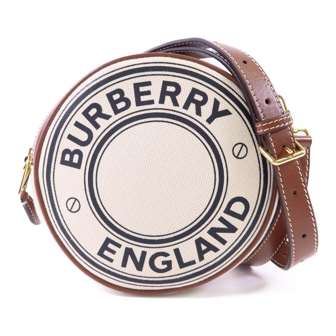 Louise Beige Canvas Shoulder Bag by Burberry with Gold Hardware: Louise Beige Canvas Shoulder Bag by Burberry with Gold Hardware This Burberry Louise shoulder bag features a classic beige and brown canvas exterior, offering a timeless and versatile style. Crafted i