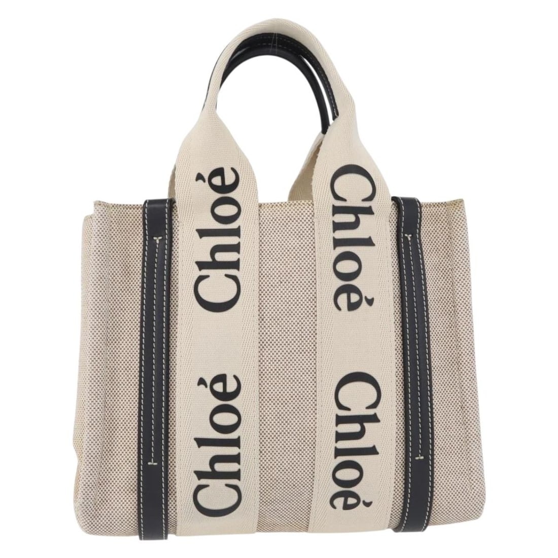 Chloe Beige Canvas and Leather Woody Convertible Tote Bag: Chloe Beige Canvas and Leather Woody Convertible Tote Bag The Chloe Woody Convertible Tote is crafted from beige canvas with leather accents. This tote is designed for women and offers a versatile loo