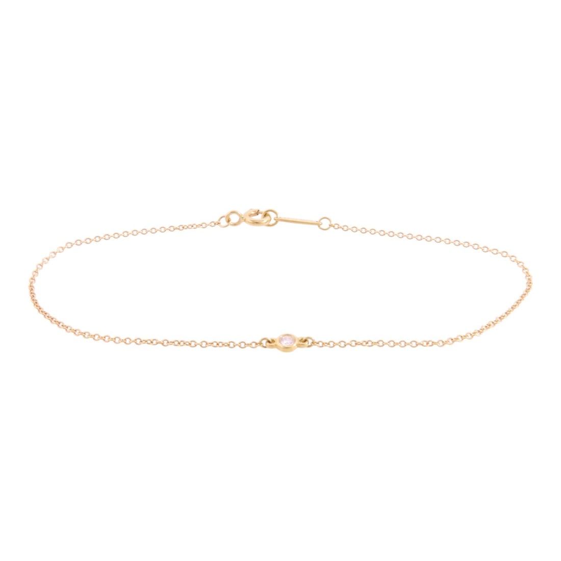 Tiffany & Co. 18K Yellow Gold Diamond Bracelet: Tiffany & Co. 18K Yellow Gold Diamond Bracelet This exquisite Tiffany & Co. bracelet showcases a stunning design crafted from 18K yellow gold (K18). The piece features a clear diamond as the main ston