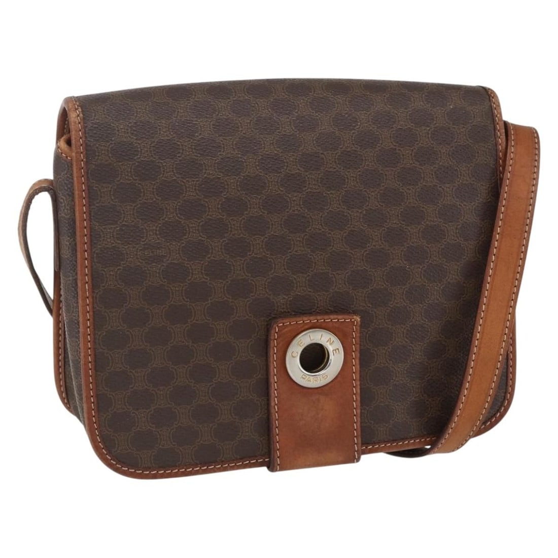 Brown PVC Celine Macadam Shoulder Bag 22cm by 18cm by 7cm: Brown PVC Celine Macadam Shoulder Bag 22cm by 18cm by 7cm This Celine Macadam shoulder bag is crafted from brown PVC material with a canvas circle design. It features a shoulder strap and metal fittin