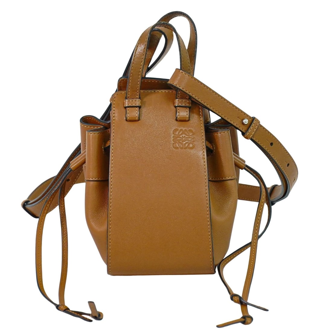 Loewe Brown Leather Hammock Drawstring Shoulder Bag: Loewe Brown Leather Hammock Drawstring Shoulder Bag The Loewe Hammock Drawstring Bag is crafted from brown leather and designed for women. This bag features a versatile drawstring closure and is made 