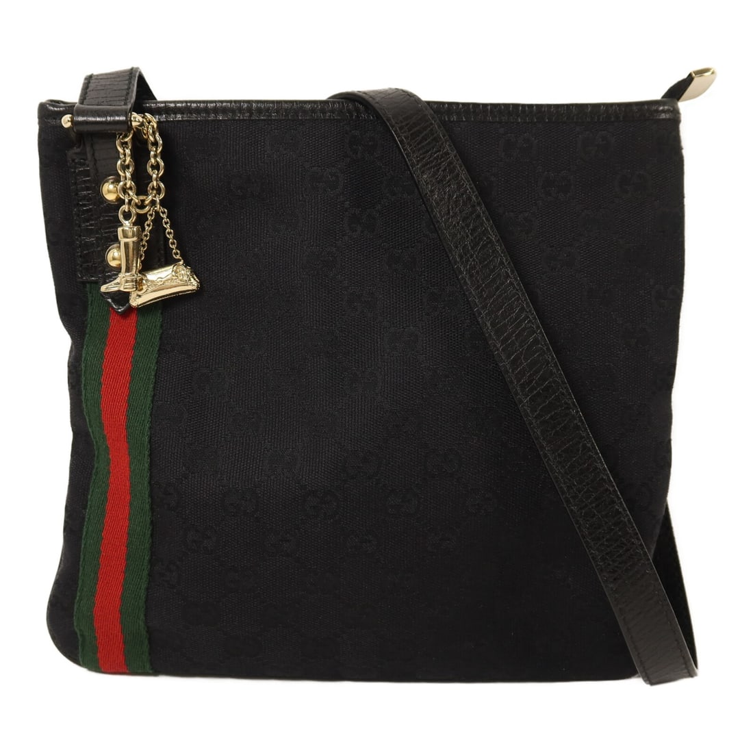 Black GG Canvas Shoulder Bag by Gucci with Gold Hardware: Black GG Canvas Shoulder Bag by Gucci with Gold Hardware This Gucci GG shoulder bag features a black GG canvas exterior and is designed for unisex use. Crafted in Italy, the bag offers a sleek and ver