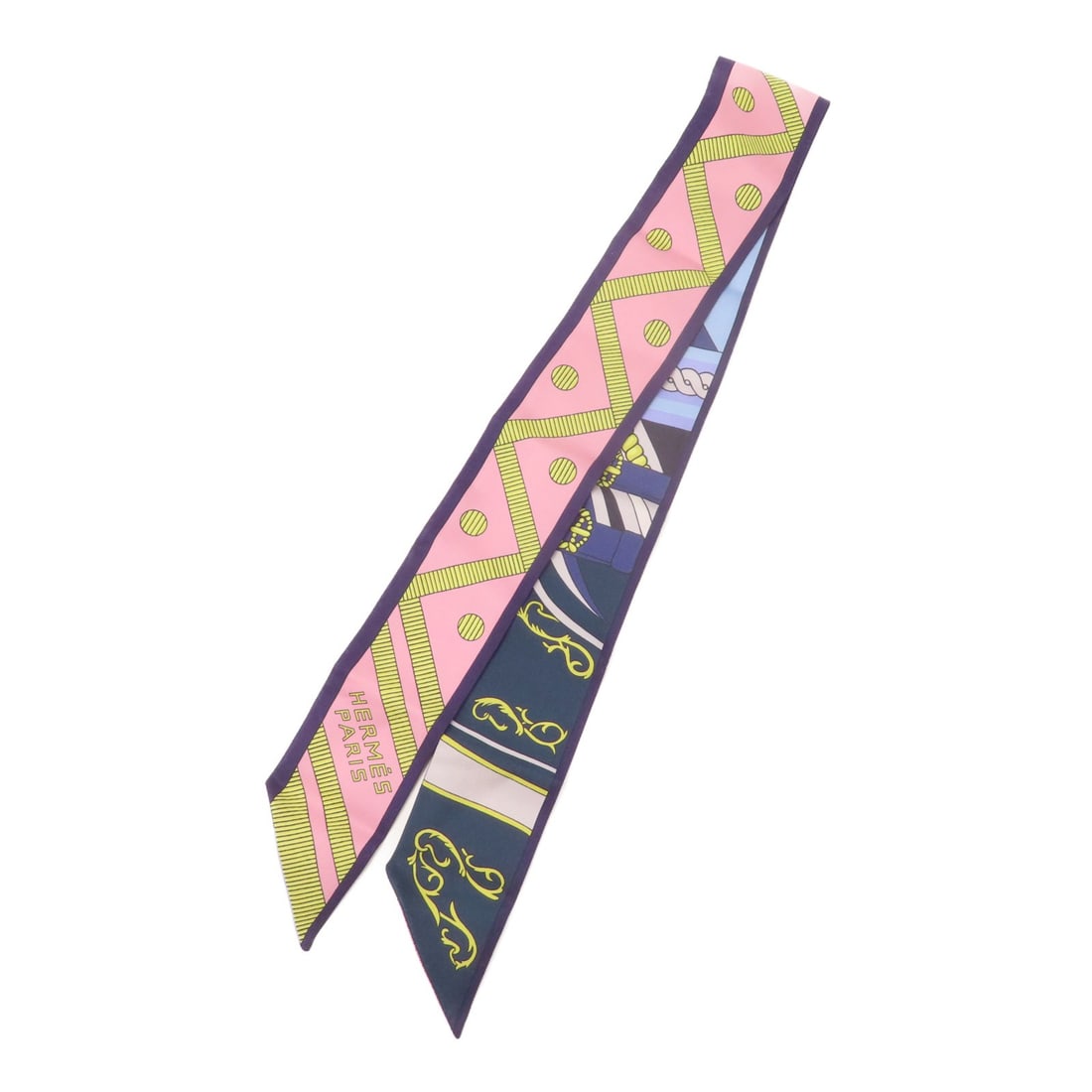 Hermes Twilly silk multicolor scarf: Hermes Twilly silk multicolor scarf This Hermes Twilly scarf is crafted from luxurious silk and features a vibrant multicolor design. Made in France, it is designed for women and offers a versatile ac