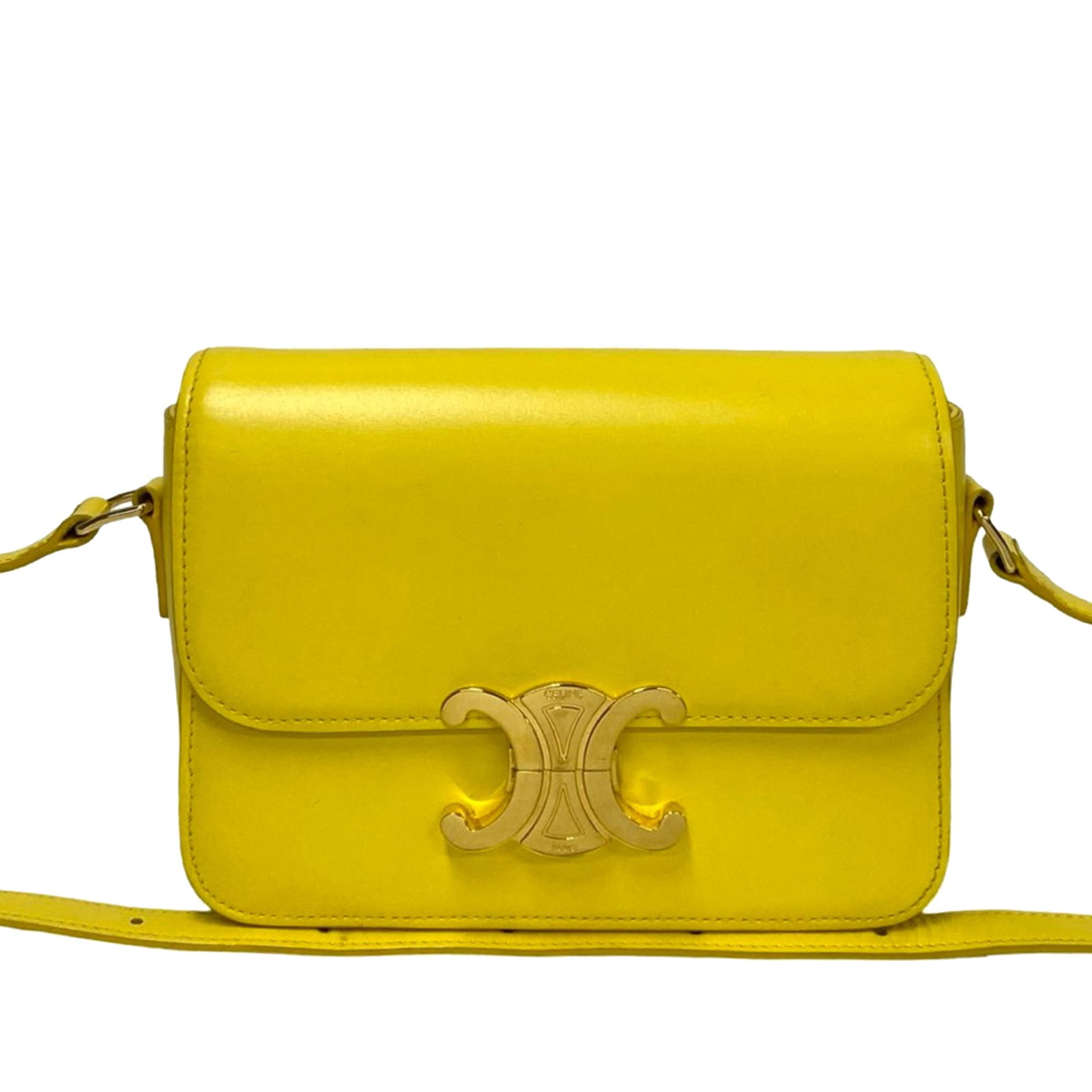 Celine Teen Triomphe Yellow Leather Crossbody Bag: Celine Teen Triomphe Yellow Leather Crossbody Bag This Celine Teen Shiny Calfskin Triomphe Crossbody features a yellow leather body with a front flap and push lock closure. It includes an adjustable f