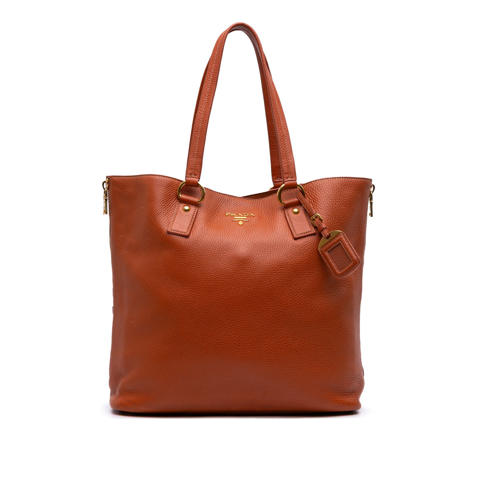 Prada Vitello Daino Orange Leather Side Zip Tote Bag: Prada Vitello Daino Orange Leather Side Zip Tote Bag Introducing the Prada Vitello Daino Side Zip Shopper Tote, a stylish and functional accessory crafted from premium leather. This tote features conv