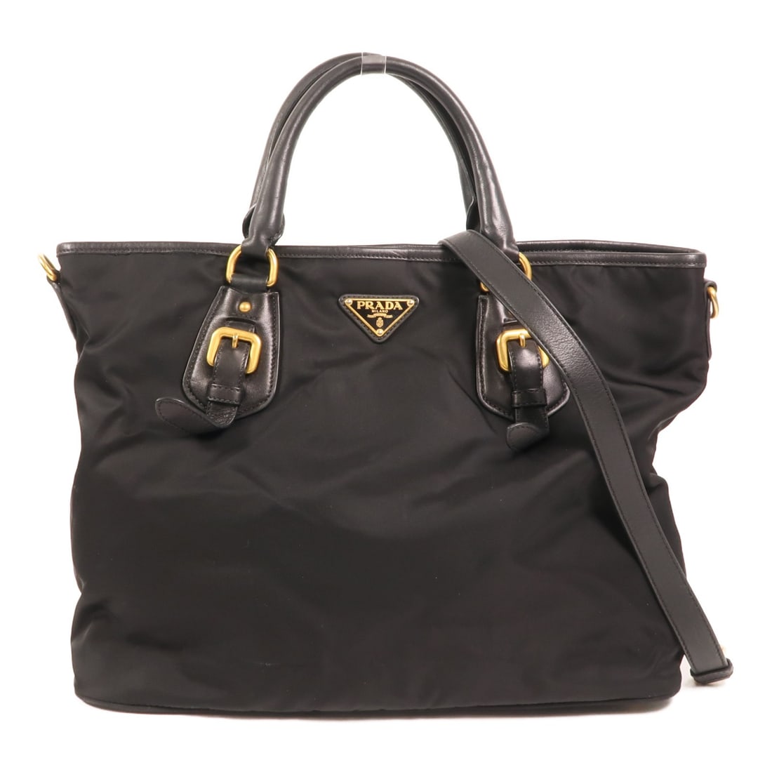 Prada Black Nylon and Leather BN1826 Two Way Shoulder Tote with Gold Hardware: Prada Black Nylon and Leather BN1826 Two Way Shoulder Tote with Gold Hardware This Prada 2-way shoulder bag features a combination of nylon and leather in a classic black color. Designed for women, it