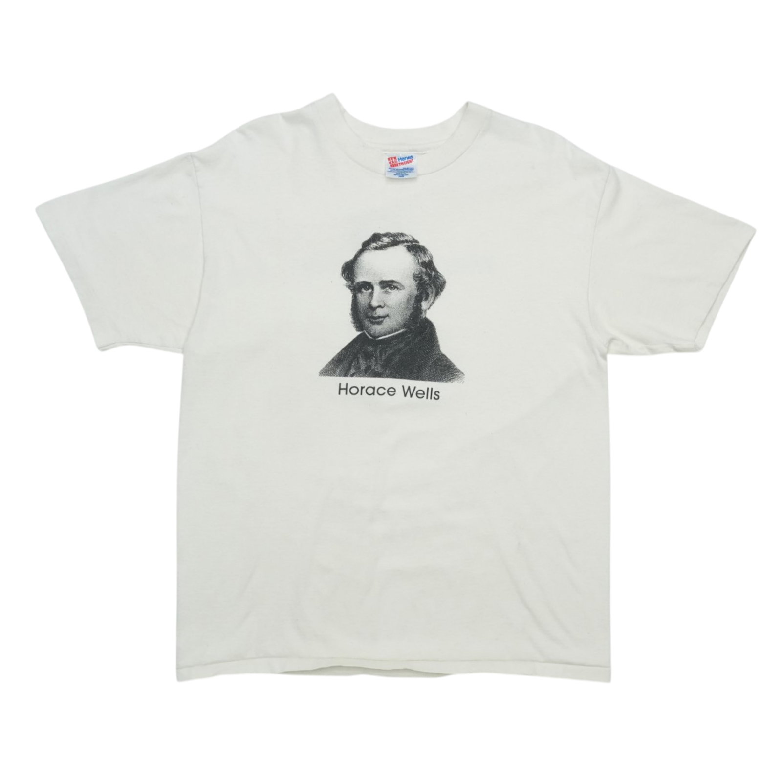 Vintage 1990s Horace Wells White Cotton Graphic Tee: Vintage 1990s Horace Wells White Cotton Graphic Tee This is an original vintage Horace Wells shirt from the 1990s, featuring a front graphic. The shirt is made from 100% cotton and comes in white. It 