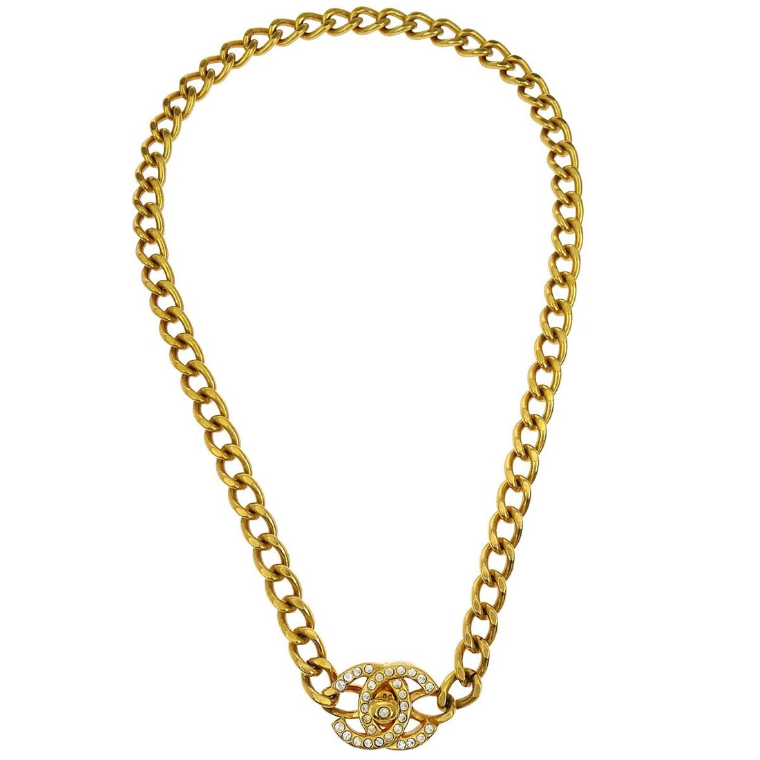Gold Plated Chain Necklace Chanel 96A Turnlock Pendant With Rhinestones: Gold Plated Chain Necklace Chanel 96A Turnlock Pendant With Rhinestones This Chanel Turnlock Charm necklace features a gold-plated chain with a pendant adorned with rhinestones. The design includes a 