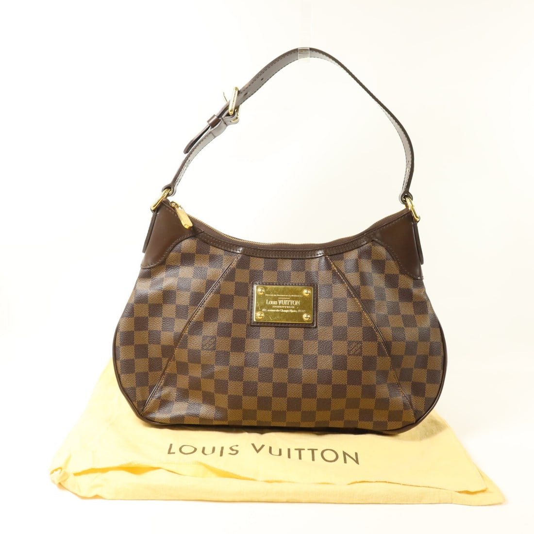 Louis Vuitton Thames PM Damier Ebene Brown Shoulder Bag GHW: Louis Vuitton Thames PM Damier Ebene Brown Shoulder Bag GHW This Louis Vuitton Thames PM shoulder bag features the iconic Damier Ebene pattern in brown PVC coated canvas. Designed for women, the bag o