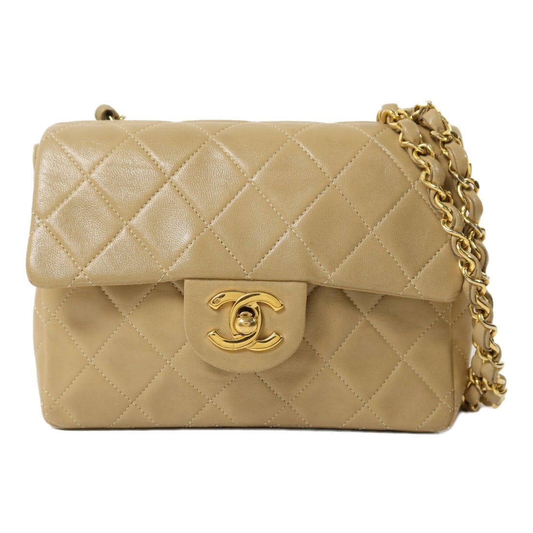 CHANEL Vintage Beige Lambskin CC Chain Shoulder Bag GHW: CHANEL Vintage Beige Lambskin CC Chain Shoulder Bag GHW This vintage CHANEL shoulder bag features beige lambskin leather and a classic chain strap design. Crafted for women, it offers a compact profil