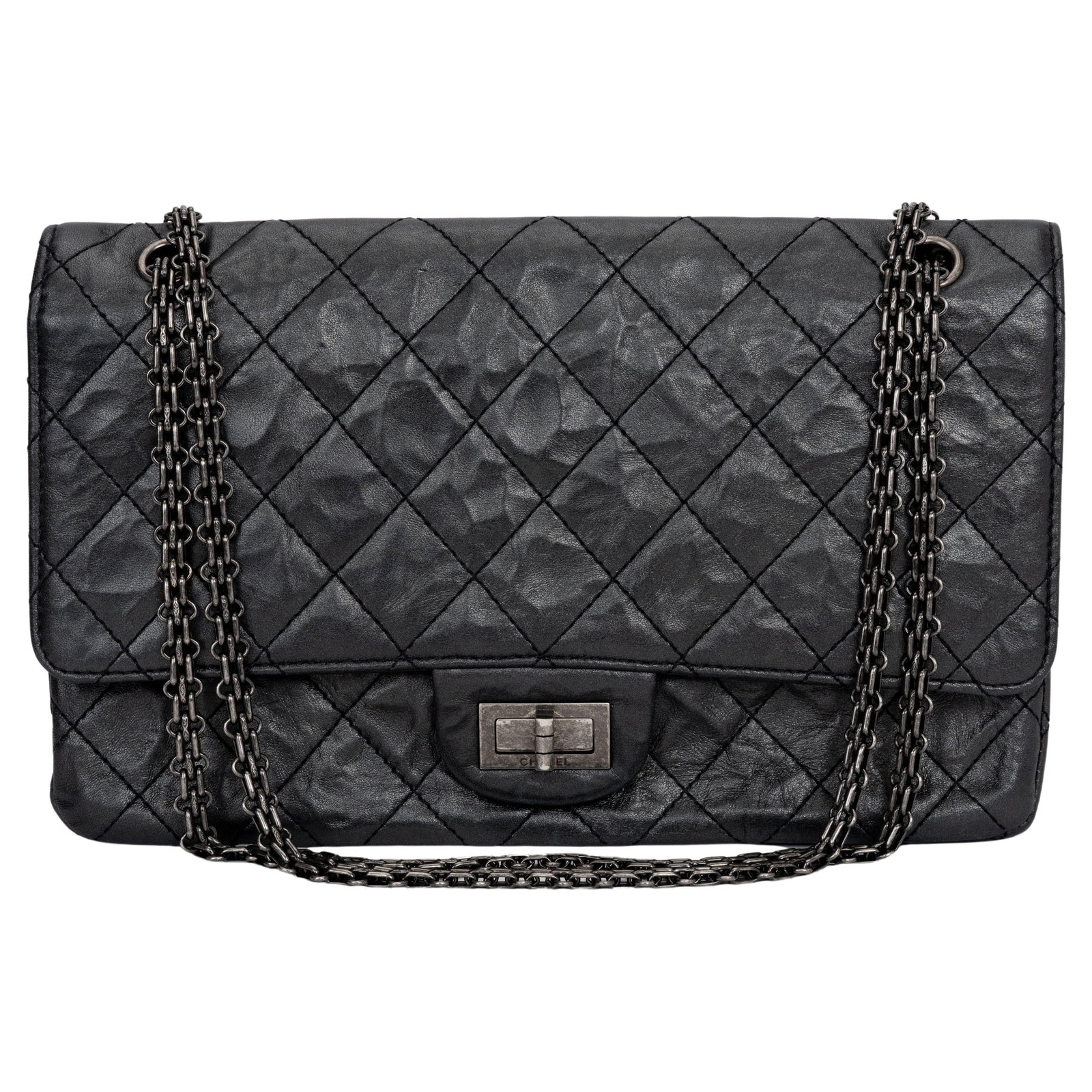 Chanel Jumbo Reissue 227 Black Aged Calfskin Handbag with Ruthenium Hardware: Chanel Jumbo Reissue 227 Black Aged Calfskin Handbag with Ruthenium Hardware This stunning Chanel Jumbo Reissue 227 handbag is crafted from luxurious black calfskin, showcasing an elegant design with 
