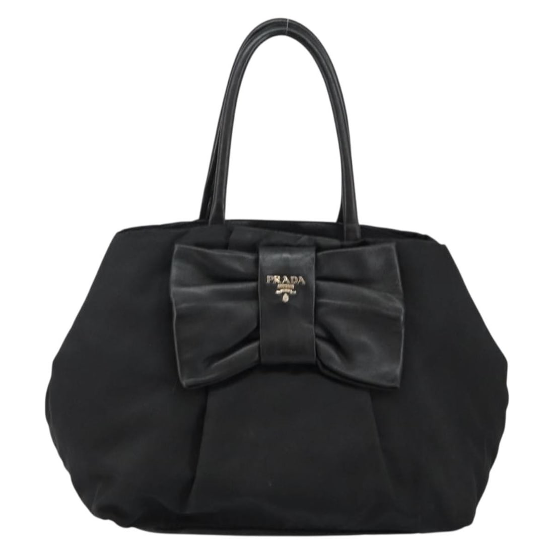 Prada Black Nylon Bow Tote Handbag with Leather Trim: Prada Black Nylon Bow Tote Handbag with Leather Trim This Prada Bow Tote for women features a black nylon body with leather accents, crafted in Italy. The tote measures 28cm x 24cm x 14cm and shows si