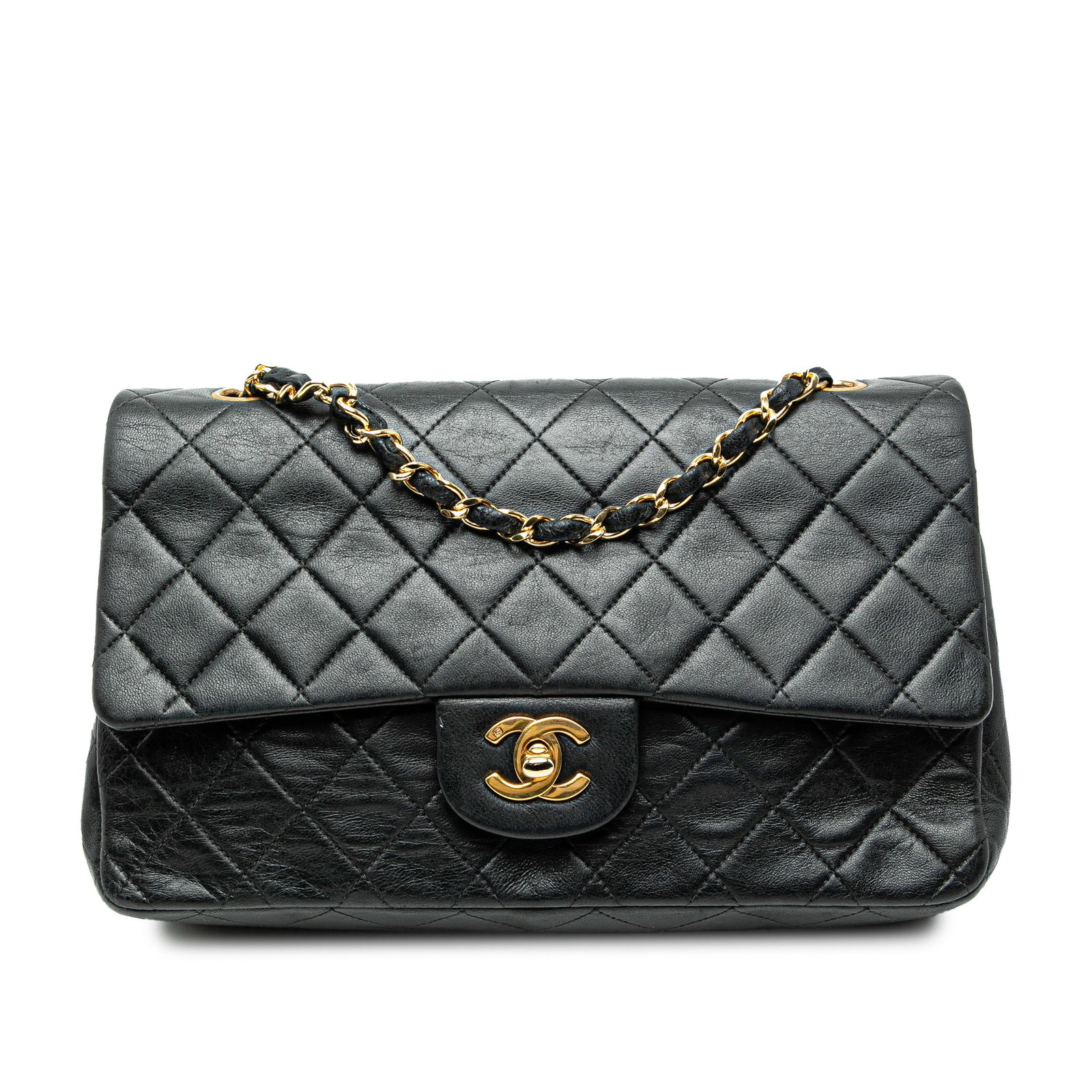 Black Chanel Medium Classic Double Flap Quilted Lambskin Shoulder Bag: Black Chanel Medium Classic Double Flap Quilted Lambskin Shoulder Bag This Chanel Medium Classic Double Flap shoulder bag is crafted from quilted black lambskin leather. It features leather-woven chai