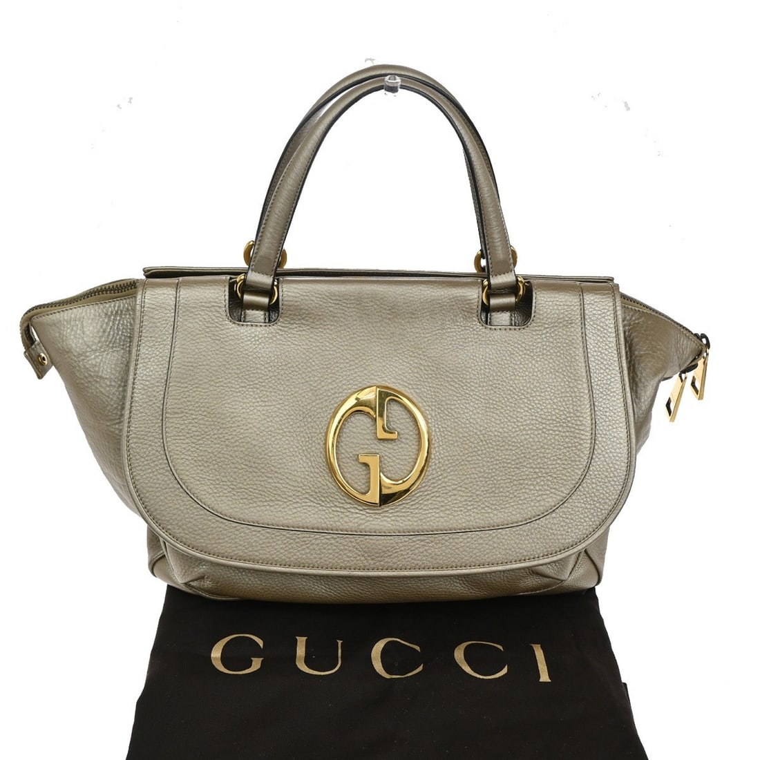 Gucci Leather Top Handle Handbag 1973 Model Gold 45cm: Gucci Leather Top Handle Handbag 1973 Model Gold 45cm This Gucci 1973 Top Handle Bag is crafted from leather in a gold color, designed for women. The pre-owned handbag is in very good condition with v
