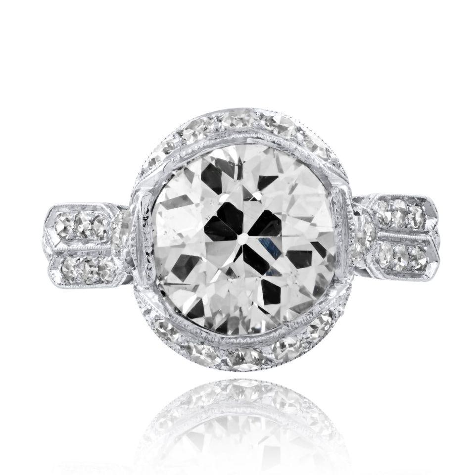 Platinum Ring Featuring 3.4 Carat Old European Cut Diamond GIA M SI2: Platinum Ring Featuring 3.4 Carat Old European Cut Diamond GIA M SI2 This pre-owned ring features an Old European cut diamond with an exact weight of 3.4 carats, set in platinum. The diamond has an M 