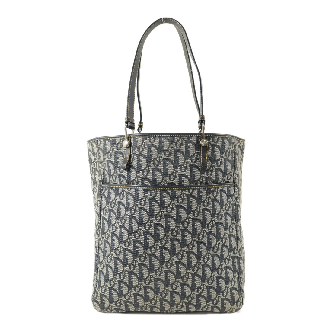 Dior Blue Canvas Vintage Handbag SHW: Dior Blue Canvas Vintage Handbag SHW This vintage Christian Dior handbag features a classic blue canvas exterior and a structured silhouette. Designed for women, the bag is crafted in France and offer