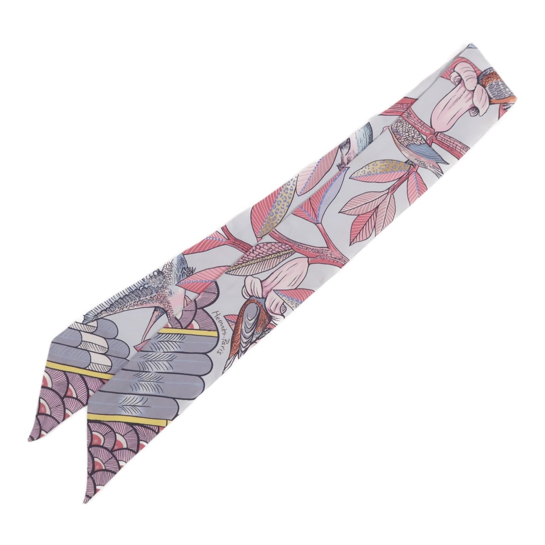 Twilly Silk Multicolor Scarf by Hermes France: Twilly Silk Multicolor Scarf by Hermes France This Hermes Twilly scarf is crafted from luxurious silk and features a vibrant multicolor design. Made in France, it offers a versatile accessory option w